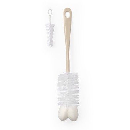 Botella de babyono y tetines con una esponja y un mini cepillo de dientes beige